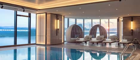 Indoor pool, open 7:00 AM to 10:30 PM, pool loungers, lifeguards on site