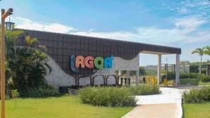 A modern building with a sign reading "AGOA ECOPOWER". - APARTMENT IN CALDAS NOVAS/LAGOA ECO TOWER RESORT... (Setor Lagoa Quente Caldas Novas)