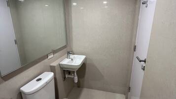 Shower, towels, soap, toilet paper