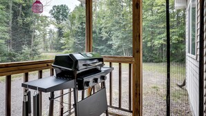 A wooden deck with a grill and cooking utensils. - Private UP Escape Near Lake Superior (Pelkie)