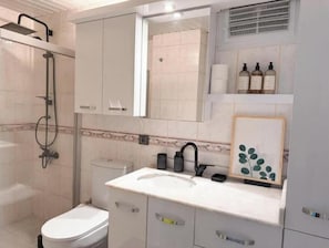 Shower, hair dryer, towels, soap