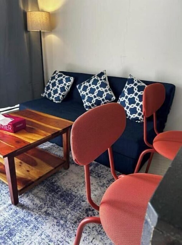 Living area - The Cozy Den (Thane)