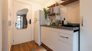 Fridge, microwave, stovetop, cookware/dishes/utensils
