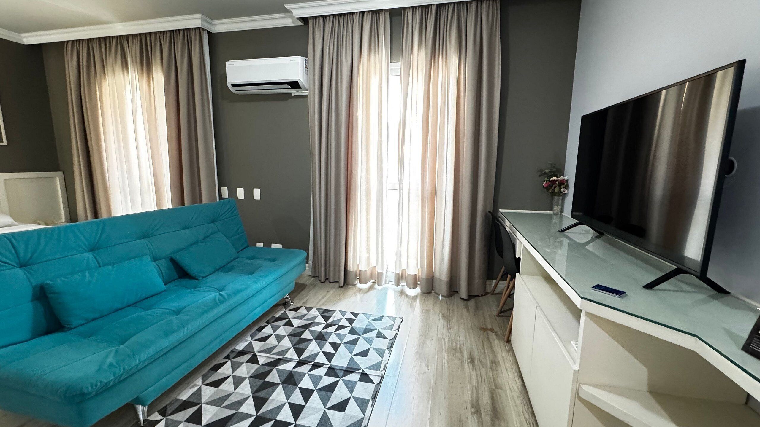 Deluxe Suite | Living area | 50-inch Smart TV with digital channels