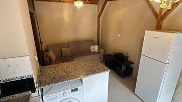 Family Condo, Balcony, Garden View | Living area