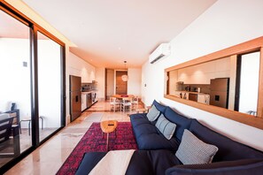 Comfort Apartment, Ocean View | Living area | 50-inch flat-screen TV with digital channels