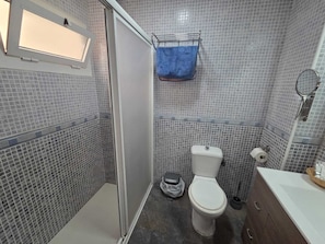 Shower, towels, soap, toilet paper