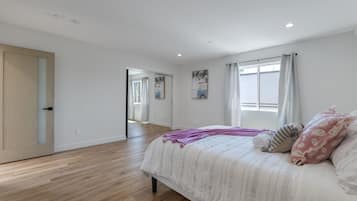 Desk, laptop workspace, blackout curtains, iron/ironing board