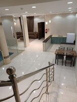 Fridge, stovetop, electric kettle, cleaning supplies