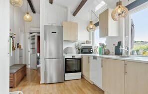 Fridge, stovetop, dishwasher, coffee/tea maker