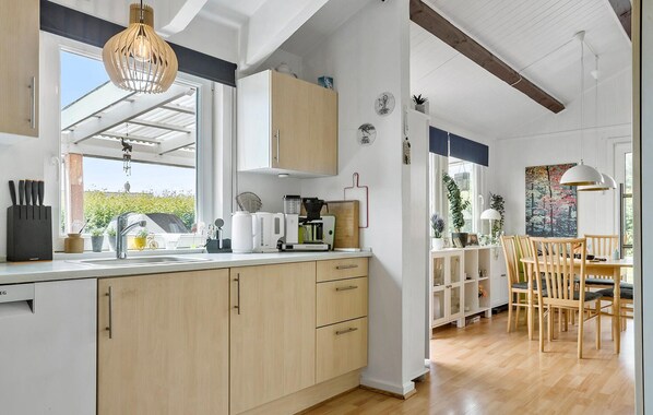 Fridge, stovetop, dishwasher, coffee/tea maker