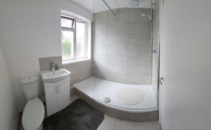 Shower, towels, soap, toilet paper