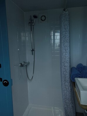 Shower, towels, soap, toilet paper