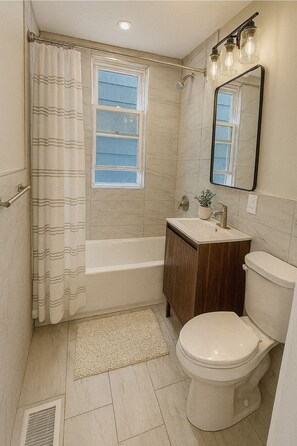 Shower, towels, soap, toilet paper