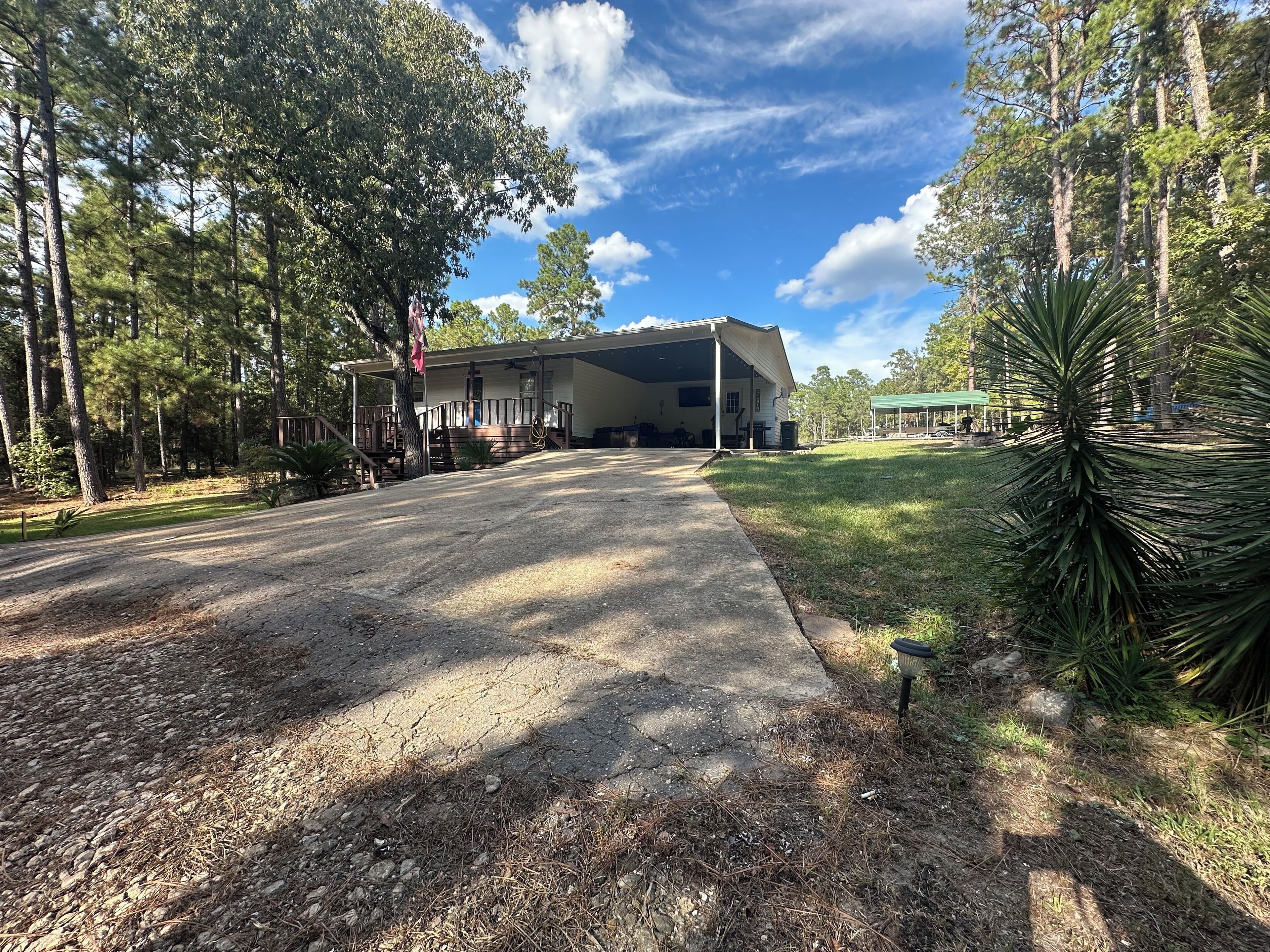 A single-story house with a covered porch and a garage.