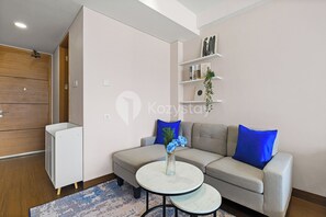 Apartment, 1 Bedroom, City View | Living area | 55-inch Smart TV with cable channels, Netflix, streaming services