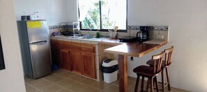 Fridge, microwave, stovetop, cookware/dishes/utensils