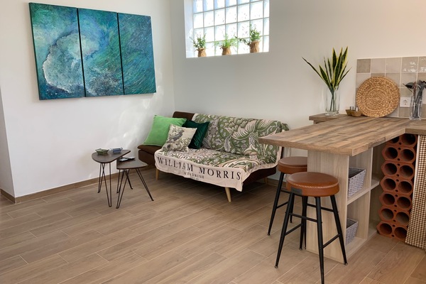 Artistically designed and furnished living area. T.V, Wi-Fi, sofa bed. Open plan with dining area and kitchen.