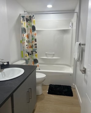 Jetted bath, hair dryer, towels, soap