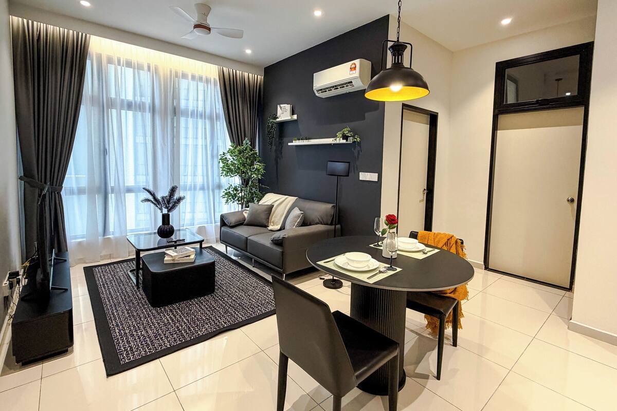 City Apartment | Living area | 55-inch flat-screen TV with digital channels