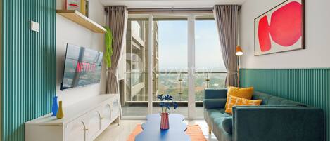 Apartment, 2 Bedrooms, City View | Living area | 43-inch Smart TV with cable channels, Netflix, streaming services