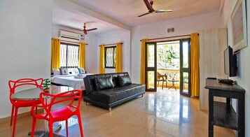 King Studio with Sofa Bed | Living area | 32-inch LED TV with satellite channels