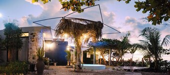 4 bedrooms in an oceanfront garden with pool and kitchenette.