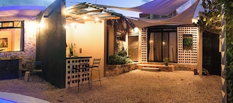 4 bedrooms in an oceanfront garden with pool and kitchenette.