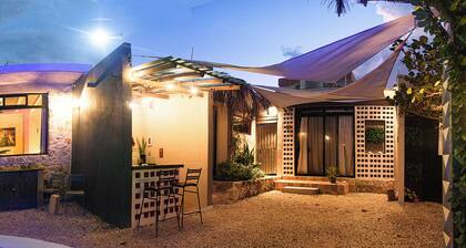 4 bedrooms in an oceanfront garden with pool and kitchenette.