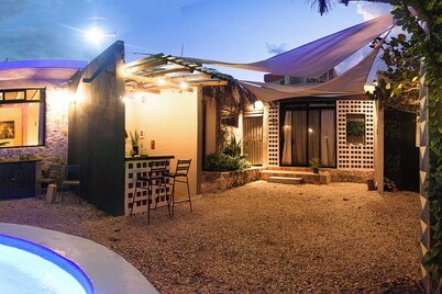 4 bedrooms in an oceanfront garden with pool and kitchenette.