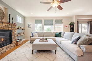 Smart TV, fireplace, books, stereo