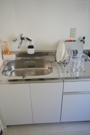 Fridge, microwave, stovetop, cookware/dishes/utensils