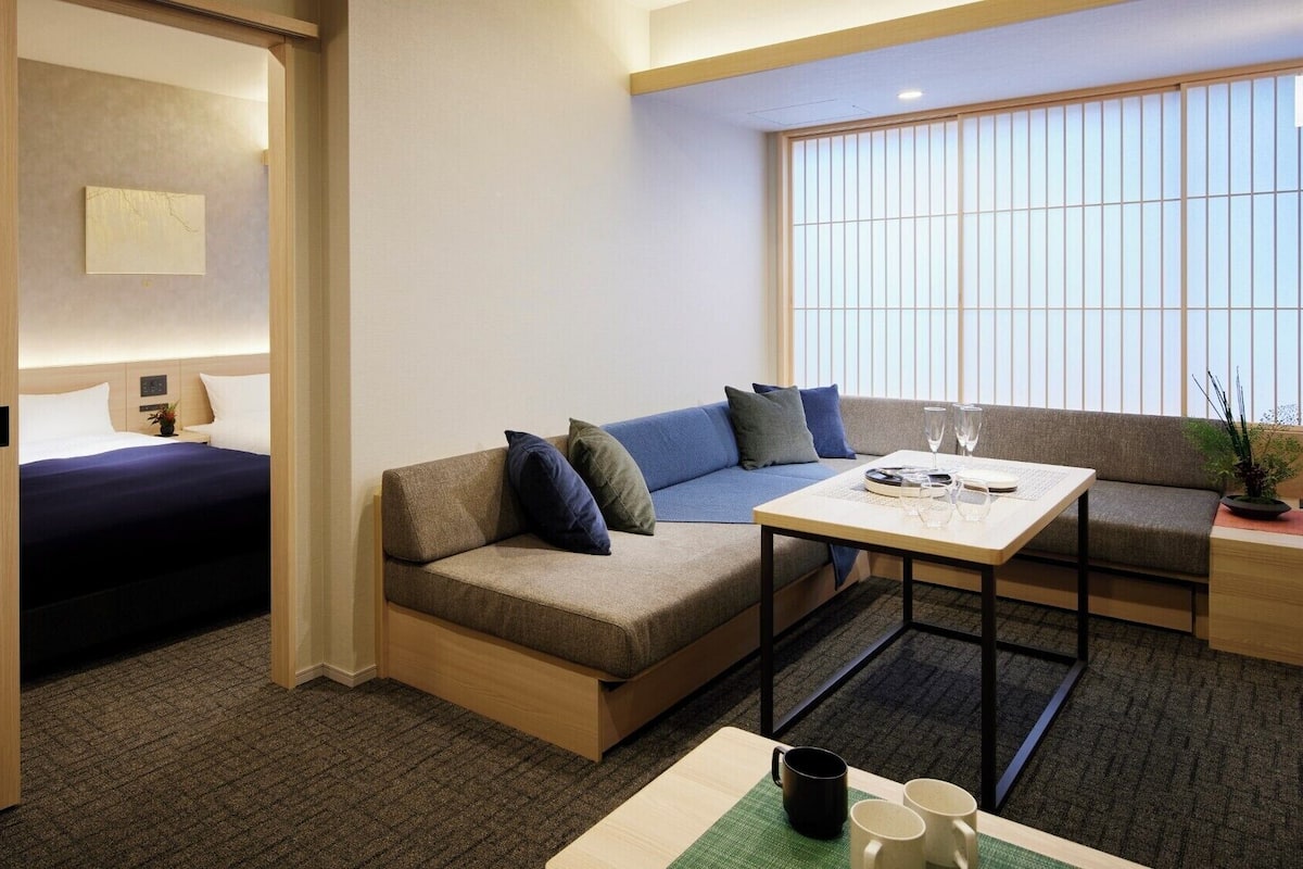 Family Suite 1 Bedroom with 5 Beds | Living area | 50-inch LCD TV with digital channels