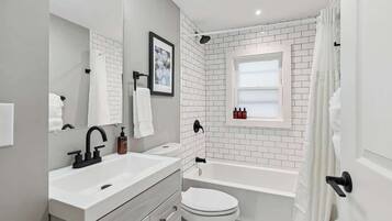 Shower, hair dryer, towels, shampoo