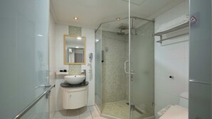 A modern bathroom with a glass-enclosed shower, a white sink, and a mirror above it. - Chang Hong Fashion Hotel - Taichung Wenxin Branch (Taichung)
