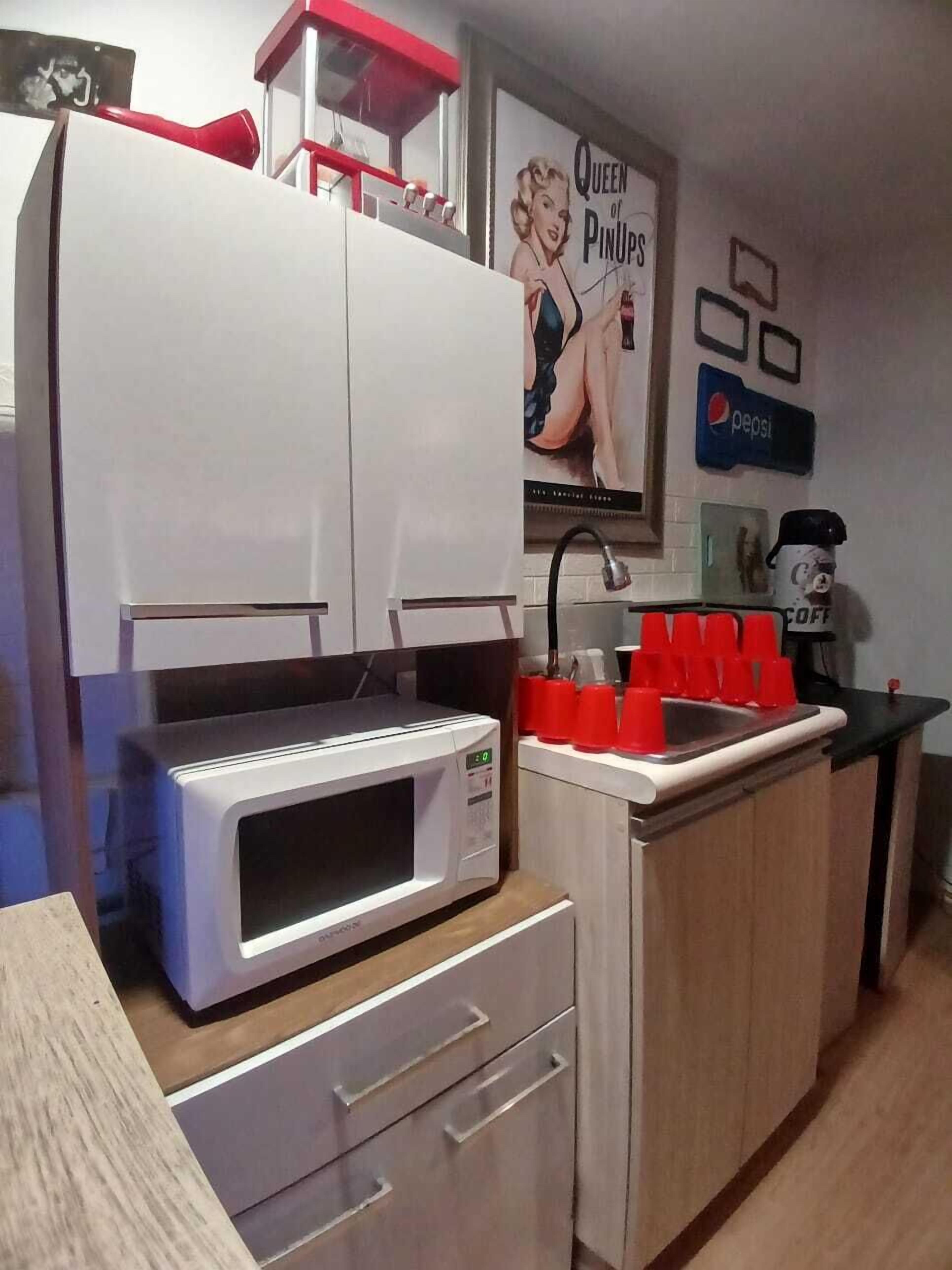 Mini-fridge, microwave, dishwasher, cookware/dishes/utensils