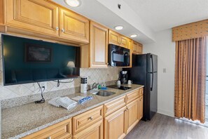 Fridge, microwave, stovetop, coffee/tea maker