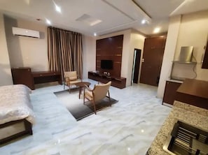 Family Apartment, Balcony, City View | Desk, laptop workspace, blackout drapes, soundproofing - Haidislah Apartment (Kano)