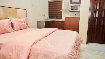 Family Apartment, Balcony, City View | Desk, laptop workspace, blackout drapes, soundproofing