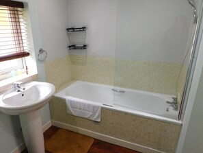 Shower, hair dryer, towels, shampoo