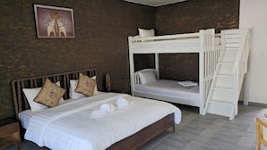 A bedroom with a large bed, a bunk bed, and a ladder. - WHITE BEACH RESORT LONGSET (Koh Rong)