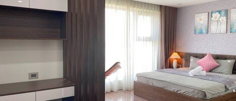 Deluxe Room, City View | In-room safe, desk, laptop workspace, iron/ironing board