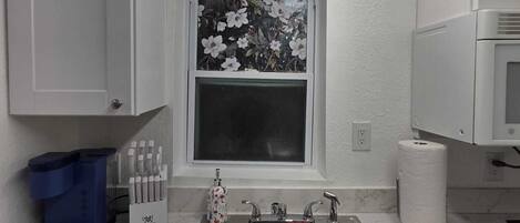 Fridge, microwave, stovetop, coffee/tea maker