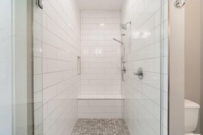 Shower, hair dryer, towels, shampoo