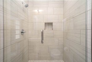 Shower, hair dryer, towels, shampoo
