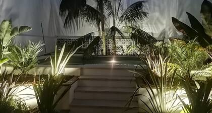 White village house with swimming pool in a quiet street in the center of town.