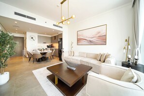 Exclusive Apartment, Balcony, Bay View | Living room | 55-inch Smart TV with digital channels - PVH - Creek Gate - Stylish 2BR (Dubai)