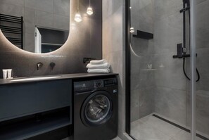 Shower, hair dryer, towels, shampoo