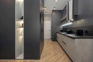Fridge, stovetop, dishwasher, coffee/tea maker