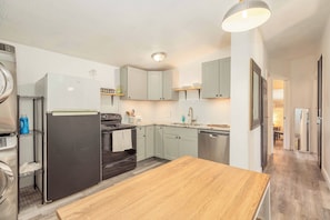Fridge, coffee/tea maker, cookware/dishes/utensils